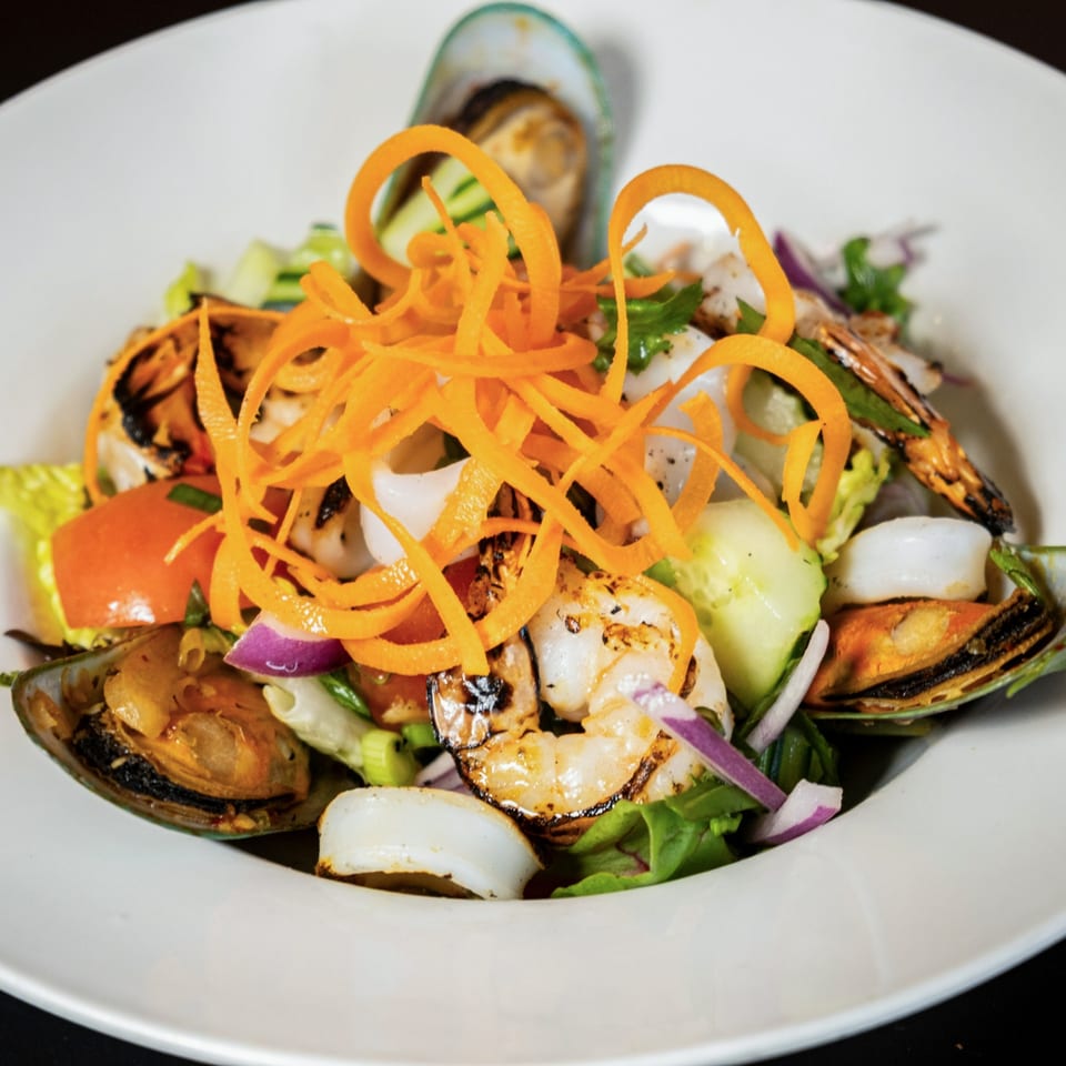 Lily Thai's seafood salad with grilled shrimp, squid, mussels, and fresh vegetables.